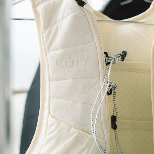 The Carry Vest shell in cream on hanger