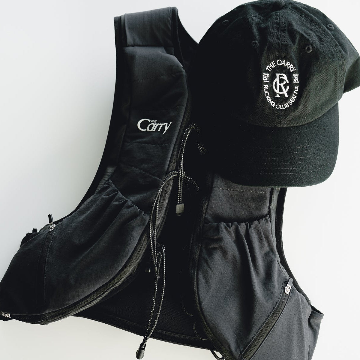 The Carry Rucking Club Seattle Lifestyle Hat in Black + The Carry weighted vest