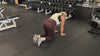 Demonstrating weighted workouts: weighted bird dogs in The Carry weighted vest