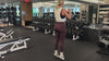 Demonstrating weighted workouts: weighted calf raises in The Carry weighted vest