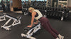 Demonstrating weighted workouts: weighted tricep pushups in The Carry weighted vest
