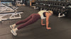 Demonstrating weighted workouts: weighted side planks + thread the needle in The Carry weighted vest