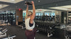 Demonstrating weighted workouts: weighted good mornings in The Carry weighted vest