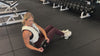 Demonstrating weighted workouts: weighted russian twists in The Carry weighted vest
