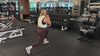 Demonstrating weighted workouts: weighted split leg squat jumps in The Carry weighted vest