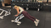 Demonstrating weighted workouts: weighted pushups in The Carry weighted vest
