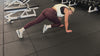 Demonstrating weighted workouts: weighted mountain climbers in The Carry weighted vest
